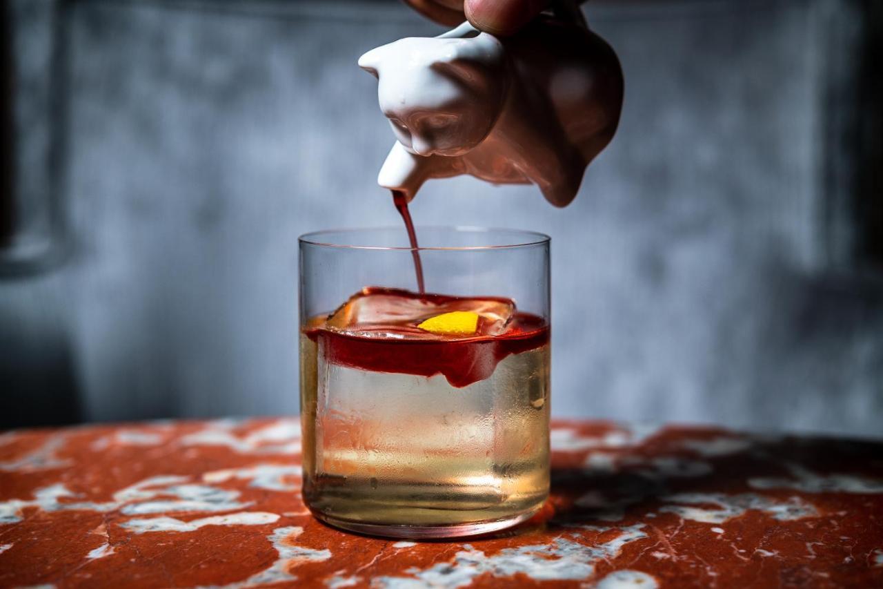 Riggs Washington Dc Ξενοδοχείο Εξωτερικό φωτογραφία A classic Old Fashioned cocktail being garnished with a cherry